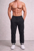 Embossed Monogram Cuffed Sweatpants - Under Attack